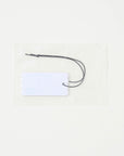 BnDR Fragrance Tag. sealed pouch with white scalloped tag showing clove jasmine musk notes. alt 01
